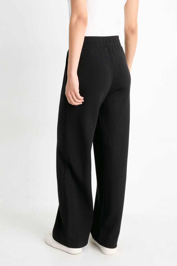 Dona - Pantalons de punt - mid waist - straight fit - negre