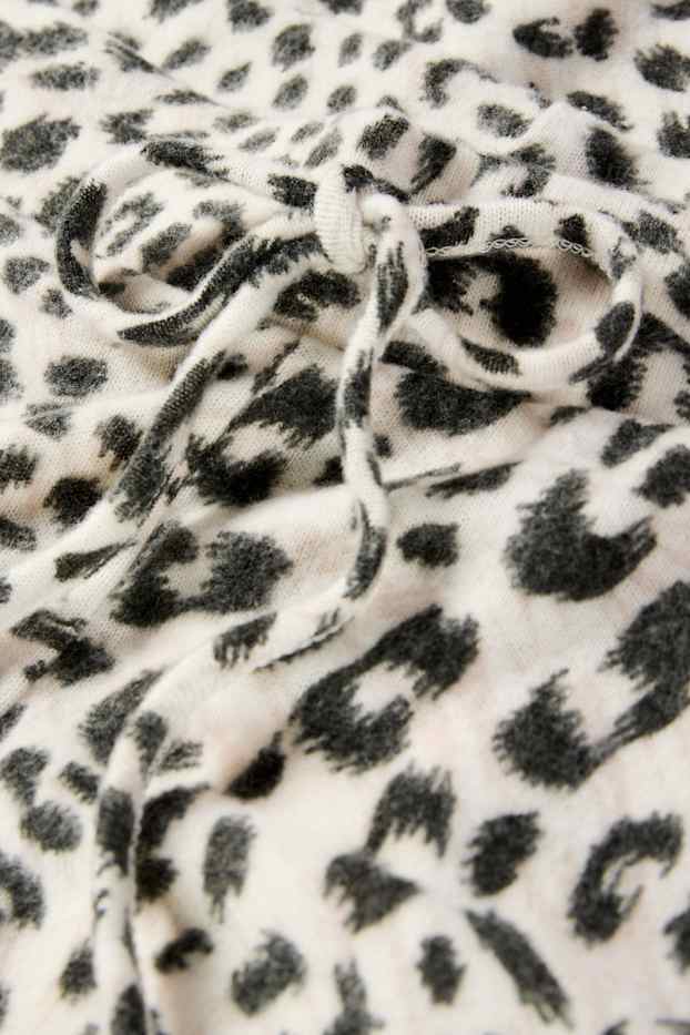 Dames - Flared legging - luipaardprint - zwart / beige