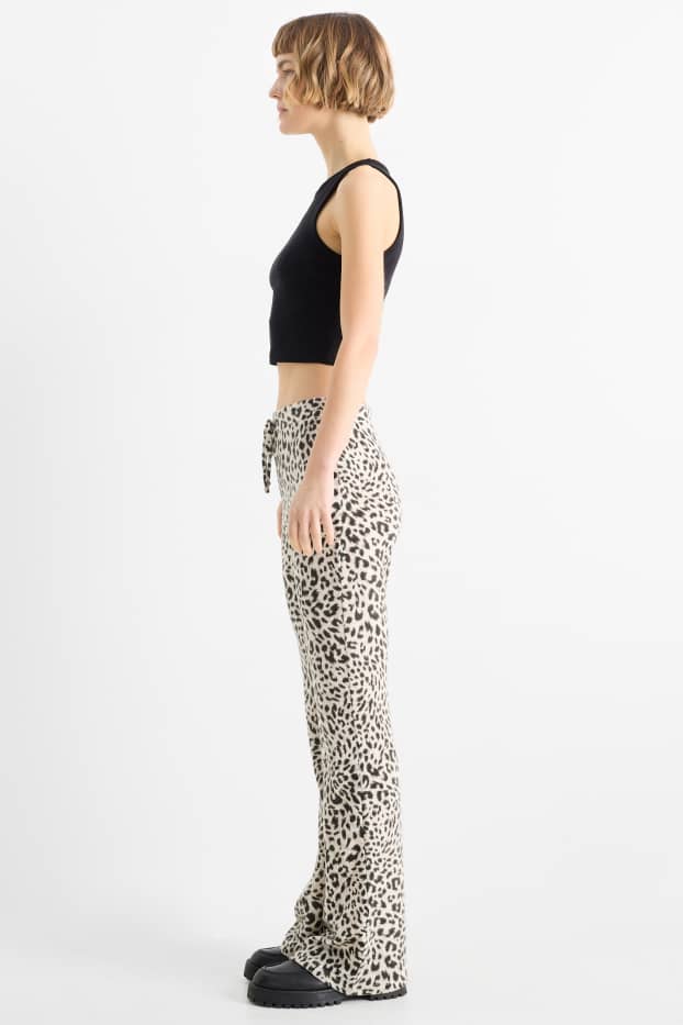 Dames - Flared legging - luipaardprint - zwart / beige