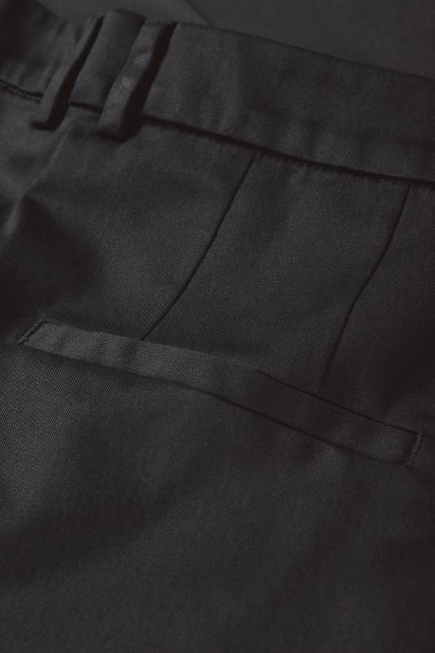 Dona - Pantalons de tela - mid waist - tapered fit - negre