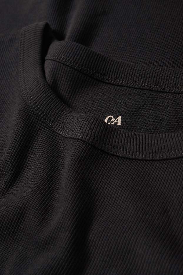 Dona - Samarreta bàsica de màniga curta - slim fit - acanalada - negre