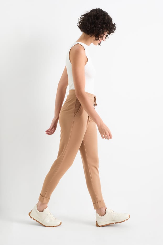 Dámské - Žerzejové kalhoty - mid waist - tapered fit - béžová