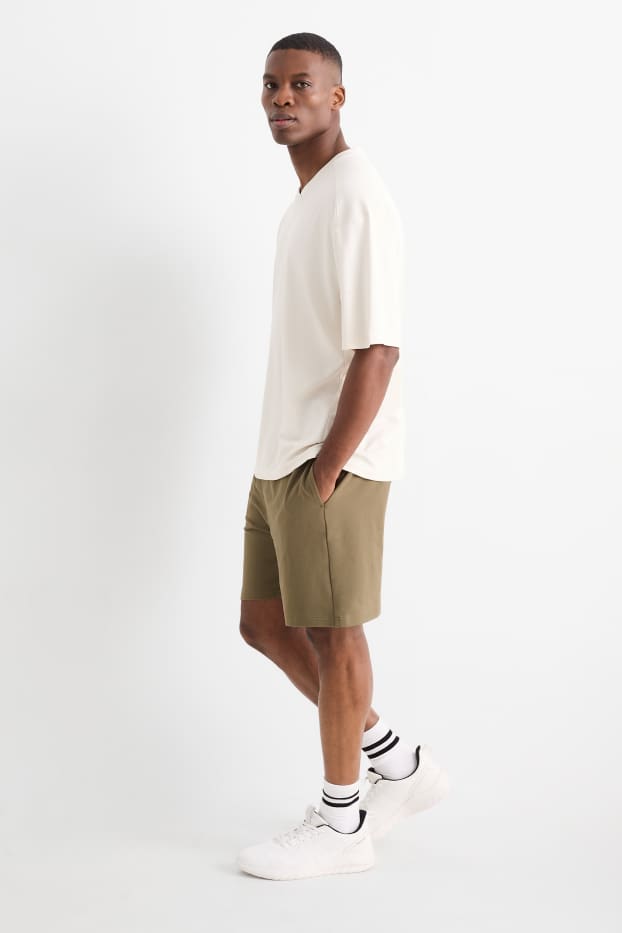 Home - Pantalons curts de xandall tècnics - verd fosc