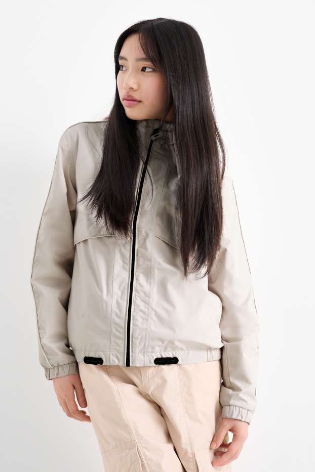 Kinderen: meisjes - Regenjas met capuchon - waterdicht - licht beige