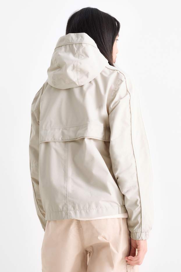 Kinderen: meisjes - Regenjas met capuchon - waterdicht - licht beige