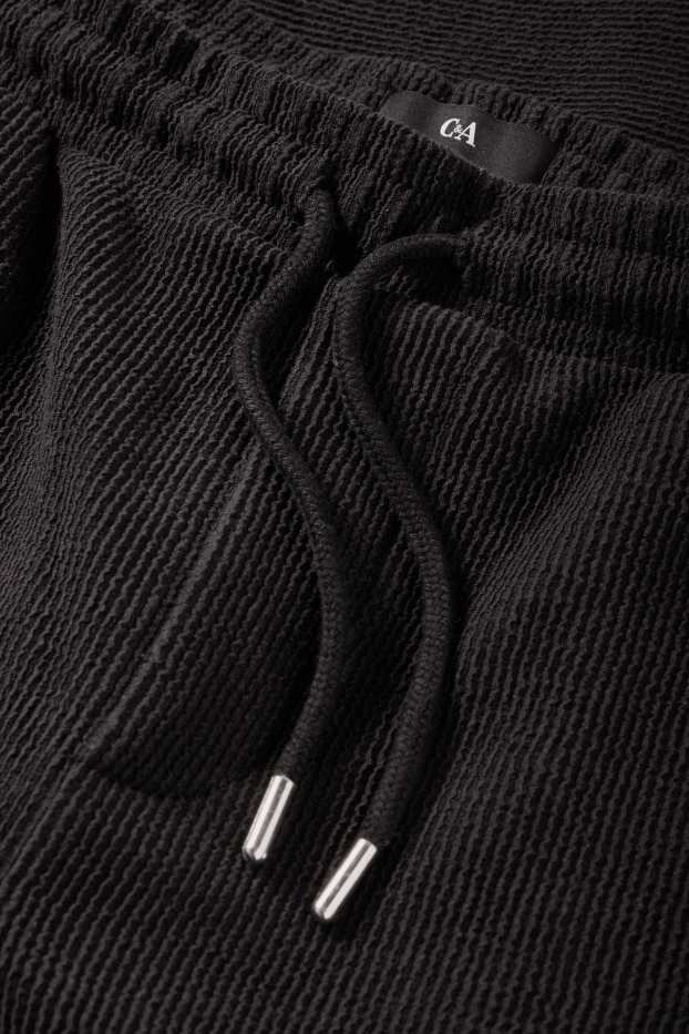 Bărbați - Pantaloni de trening - reiați - negru