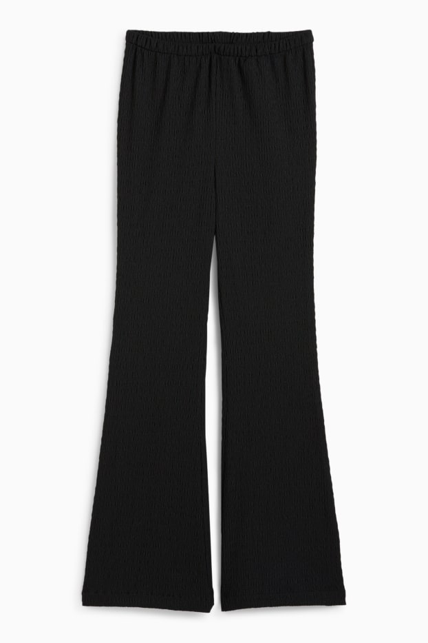 Donna - Pantaloni - vita media - flared - nero