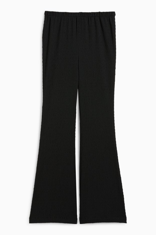 Donna - Pantaloni - vita media - flared - nero