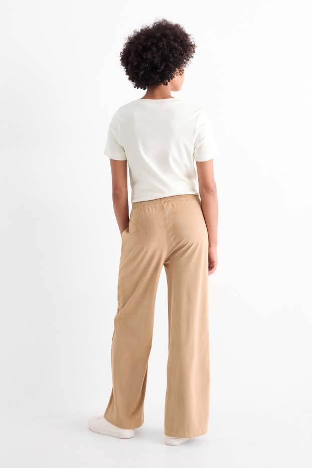 Dona - Pantalons de tela - mid waist - straight fit - pell girada sintètica - beix