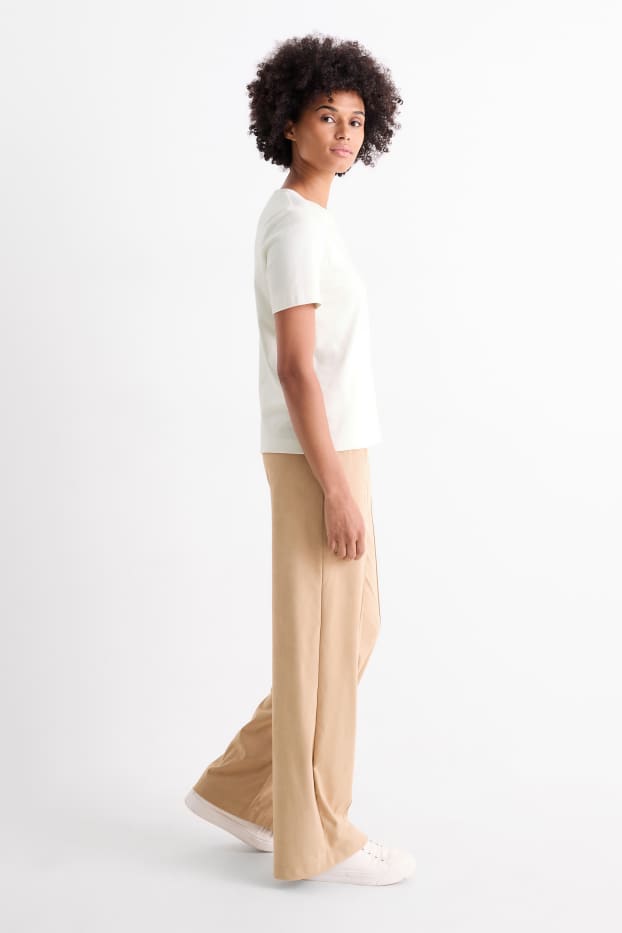 Dona - Pantalons de tela - mid waist - straight fit - pell girada sintètica - beix