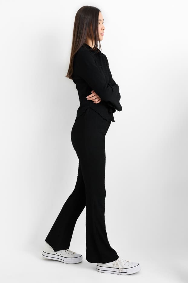 Donna - Pantaloni - vita media - flared - nero