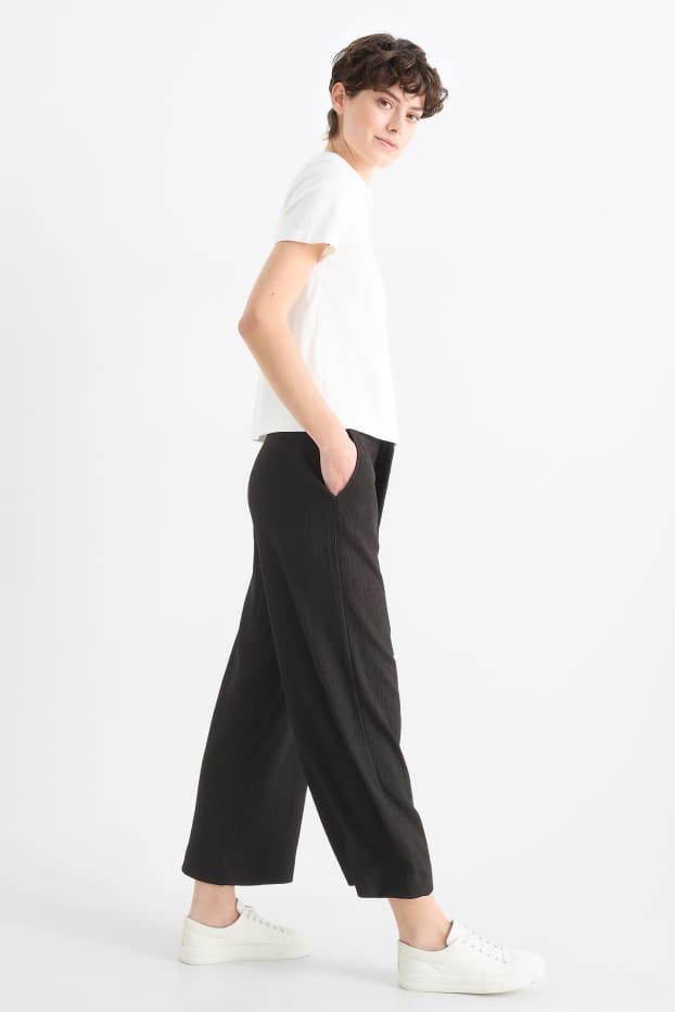 Femmes - Pantalon en jersey basique - mid waist - jambe large - finition texturée - noir