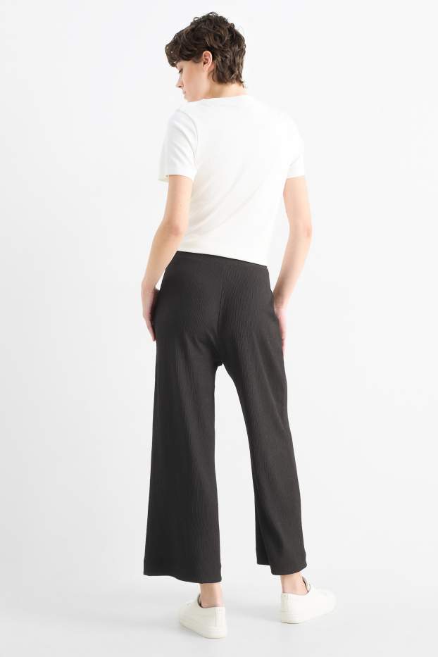 Femmes - Pantalon en jersey basique - mid waist - jambe large - finition texturée - noir