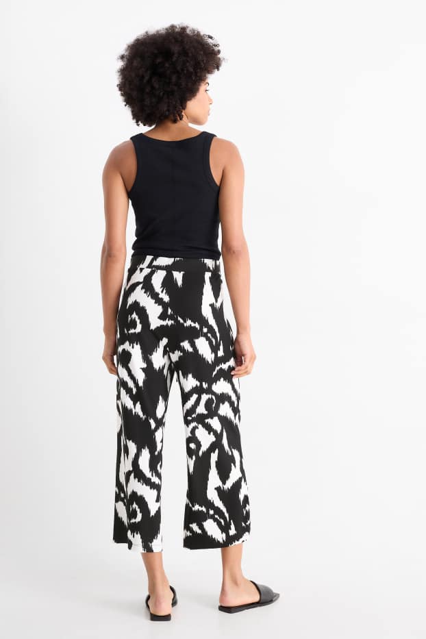 Dámské - Žerzejové kalhoty - high waist - wide leg - se vzorem - černá/bílá