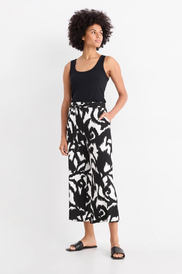 Dámské - Žerzejové kalhoty - high waist - wide leg - se vzorem - černá/bílá
