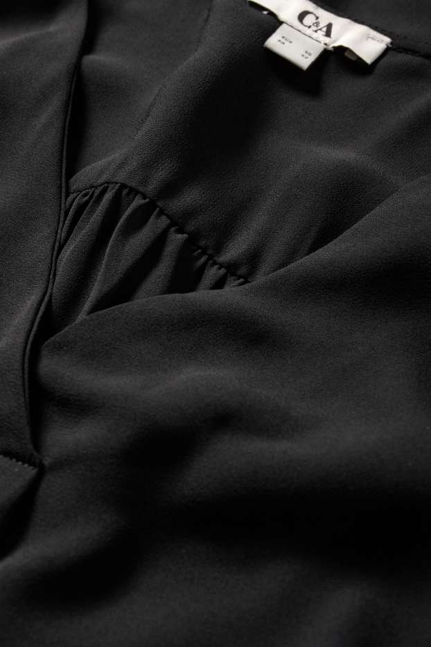 Damen - Bluse mit V-Ausschnitt - schwarz