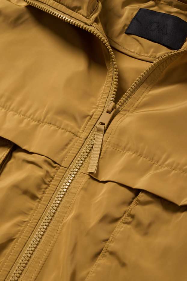 Damen - Jacke mit Kapuze - wasserabweisend - senfgelb