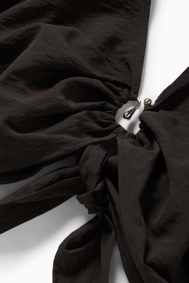 Dames - Korte blouse met V-hals - zwart