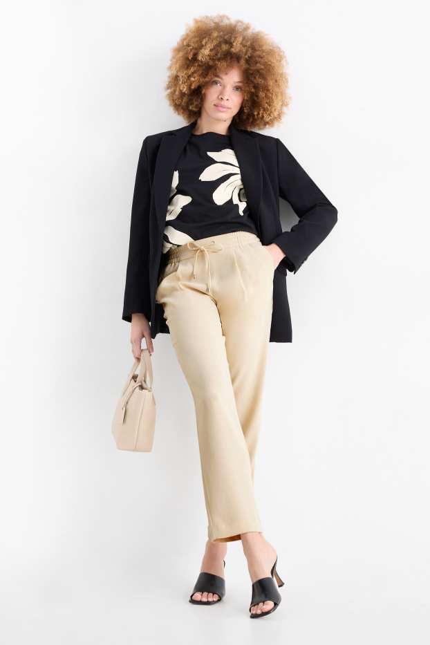 Dona - Pantalons de tela - mid waist - tapered fit - beix clar