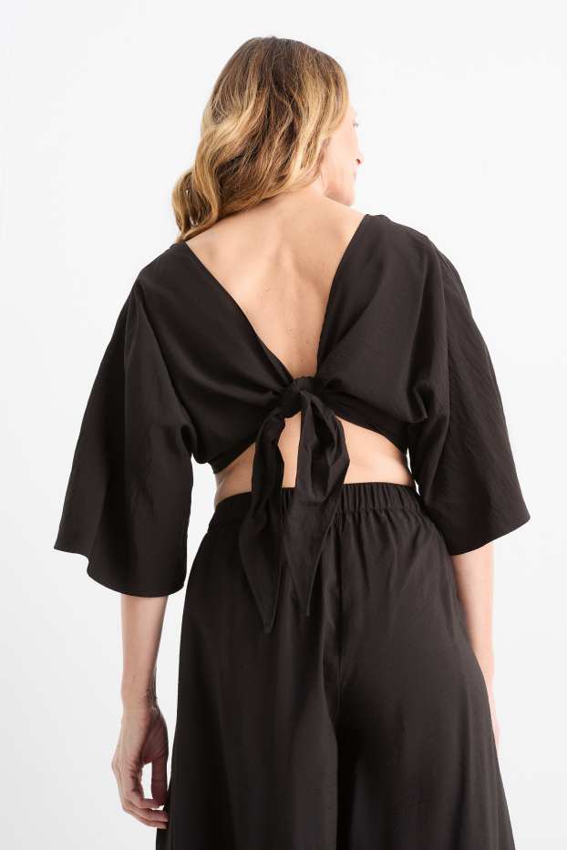 Dames - Korte blouse met V-hals - zwart