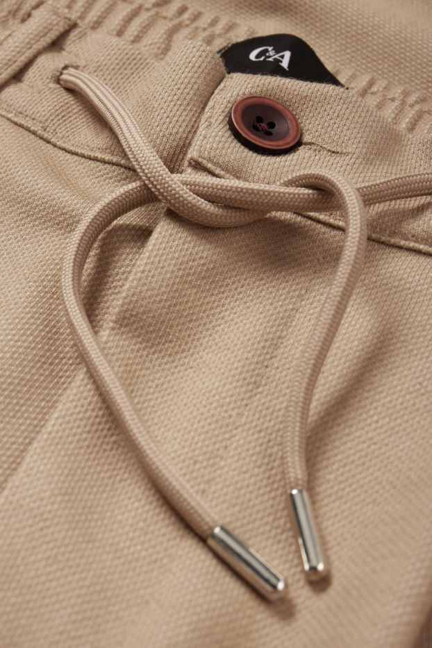Hommes - Chino - tapered fit - couleur sable