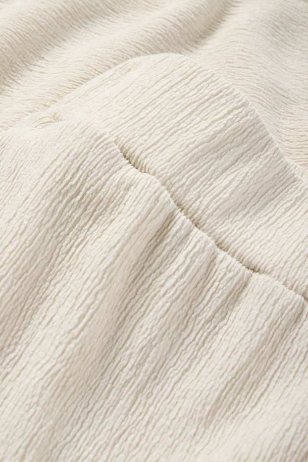 Dona - Pantalons de punt - mid waist - wide leg - texturats - beix clar
