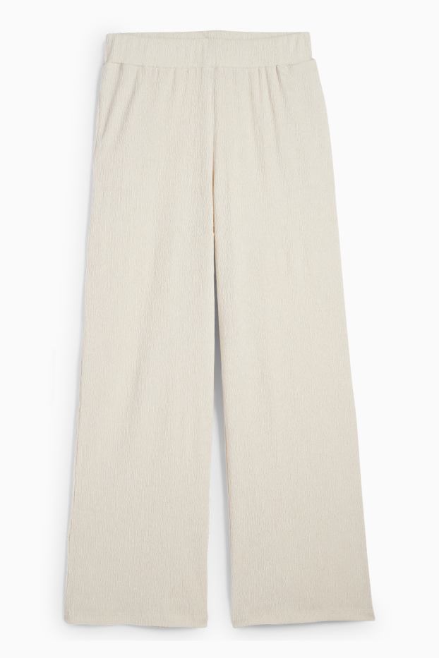 Dona - Pantalons de punt - mid waist - wide leg - texturats - beix clar