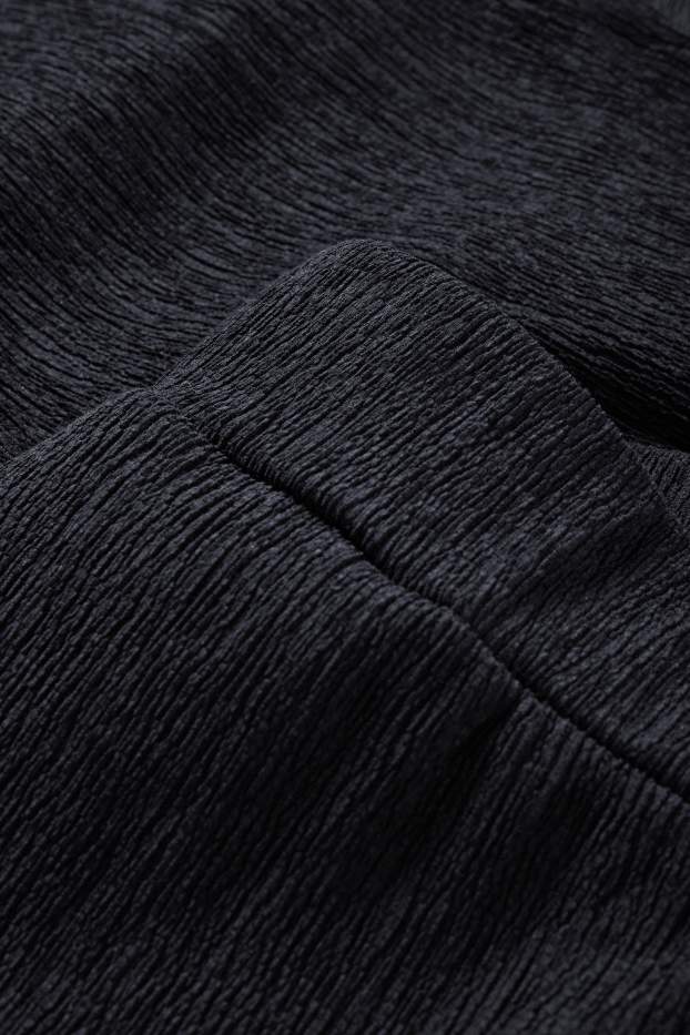 Dona - Pantalons de punt - mid waist - wide leg - texturats - negre