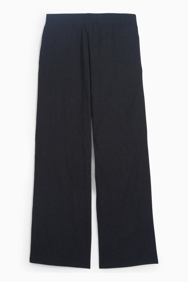 Dona - Pantalons de punt - mid waist - wide leg - texturats - negre