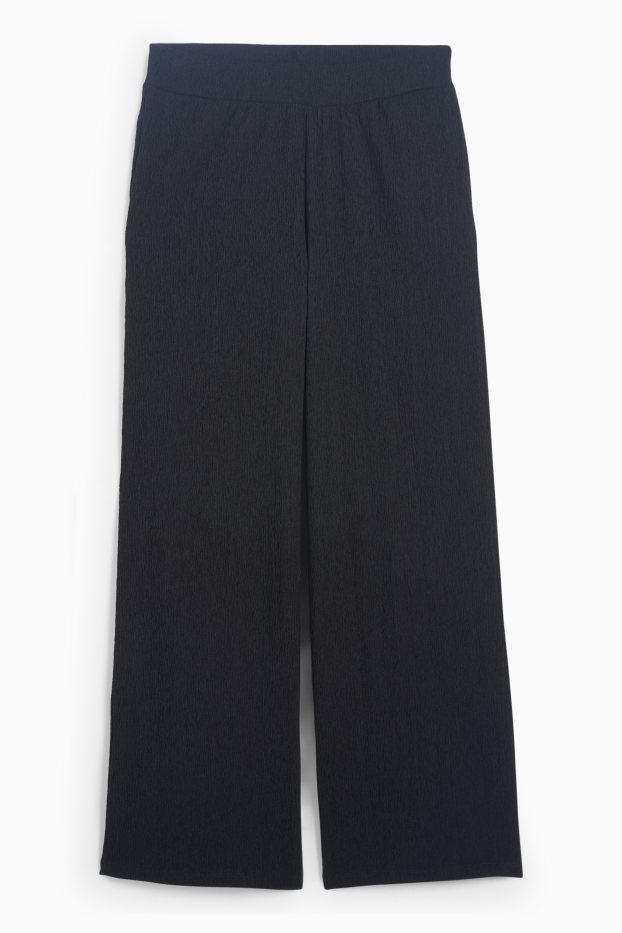 Dona - Pantalons de punt - mid waist - wide leg - texturats - negre