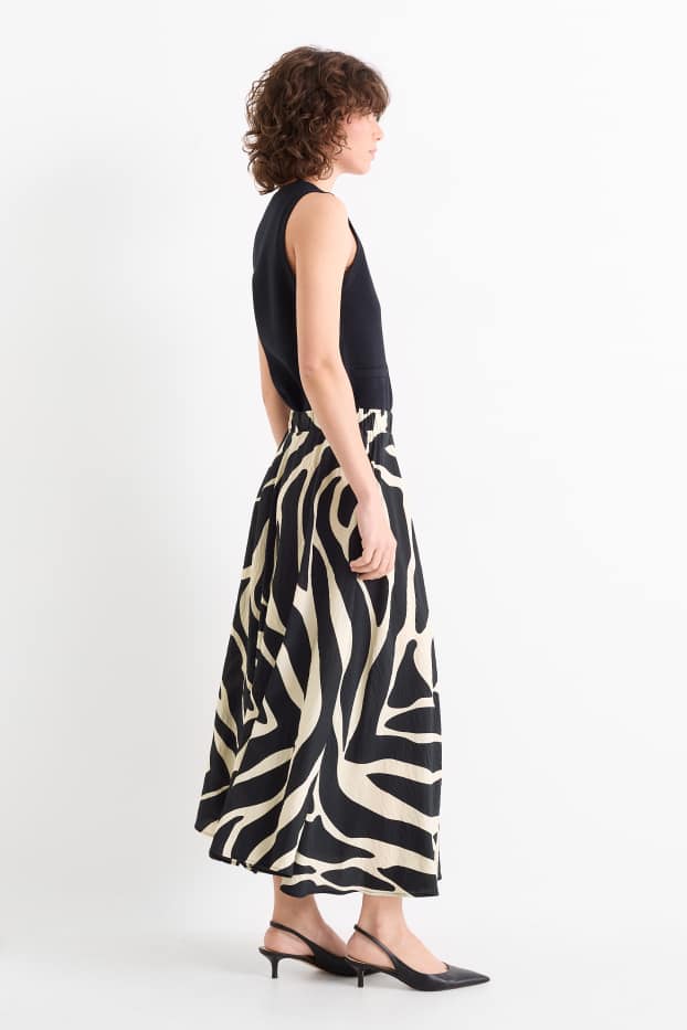 Dona - Faldilla - estampada - negre/beix