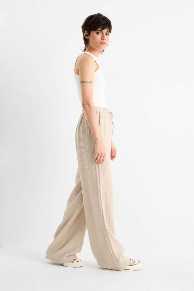 Donna - Pantaloni - vita media - gamba ampia - beige chiaro