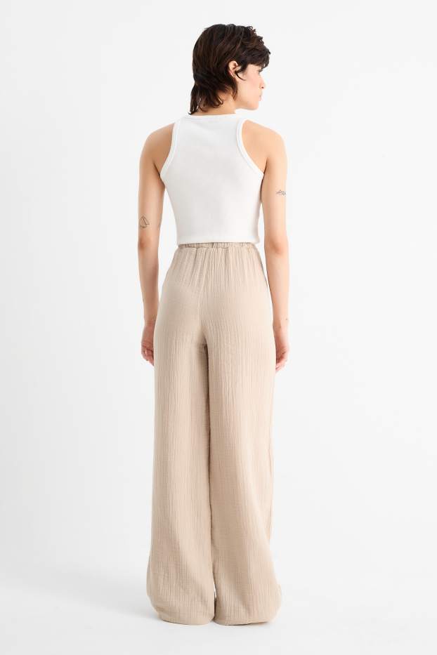 Donna - Pantaloni - vita media - gamba ampia - beige chiaro