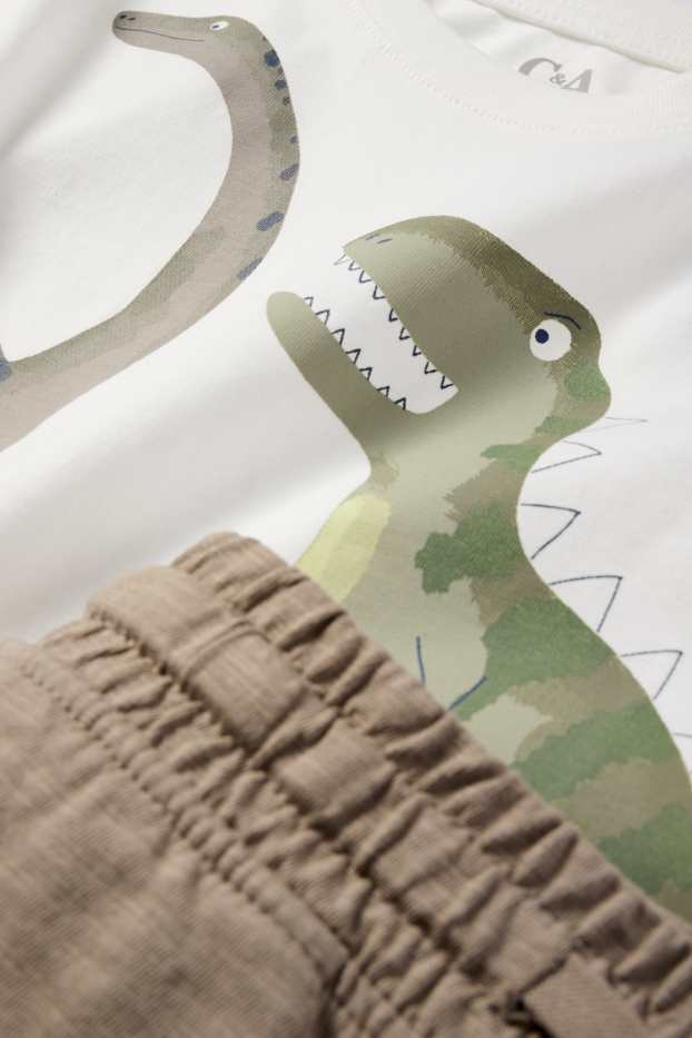 Děti - chlapci - Motivy dinosaurů - souprava - tričko s krátkým rukávem a teplákové šortky - 2dílná - krémově bílá