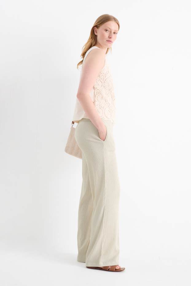 Dona - Pantalons de punt - mid waist - wide leg - texturats - beix clar