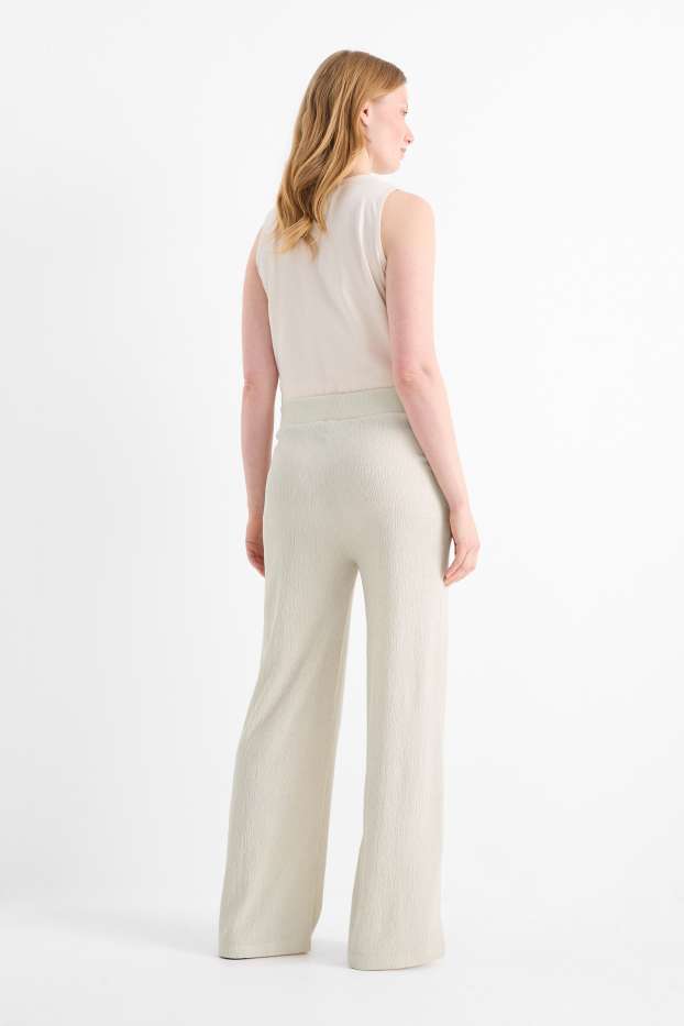 Dona - Pantalons de punt - mid waist - wide leg - texturats - beix clar