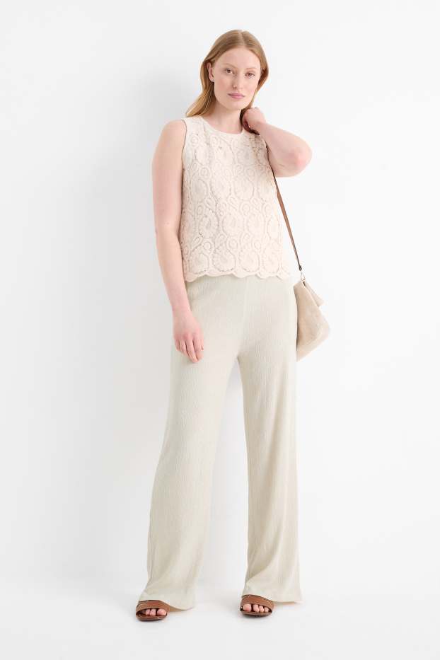 Dona - Pantalons de punt - mid waist - wide leg - texturats - beix clar