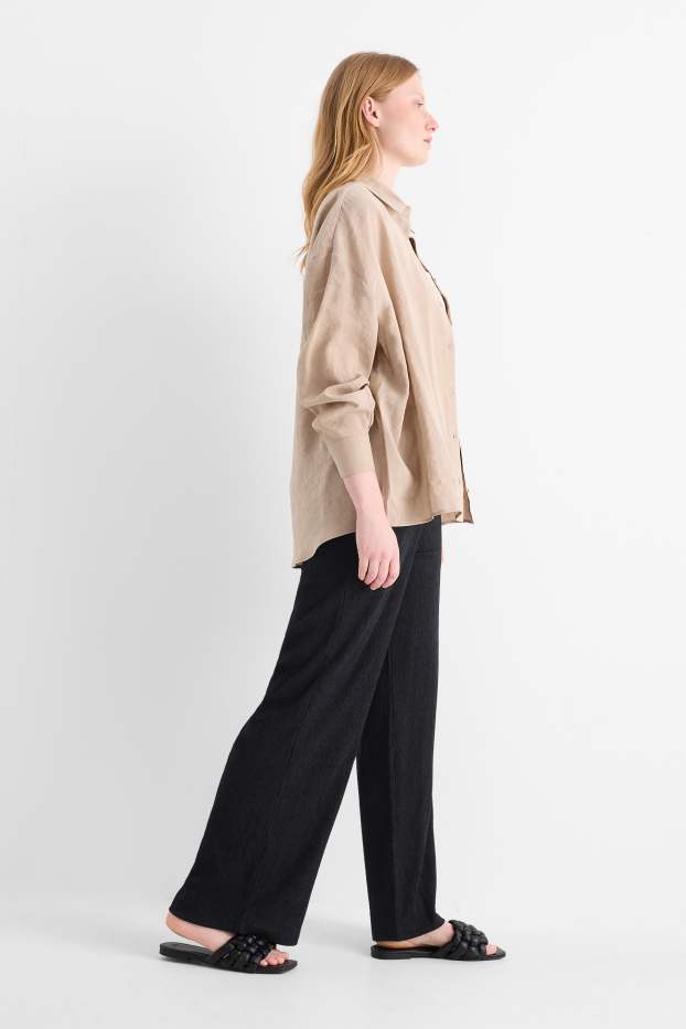 Dona - Pantalons de punt - mid waist - wide leg - texturats - negre