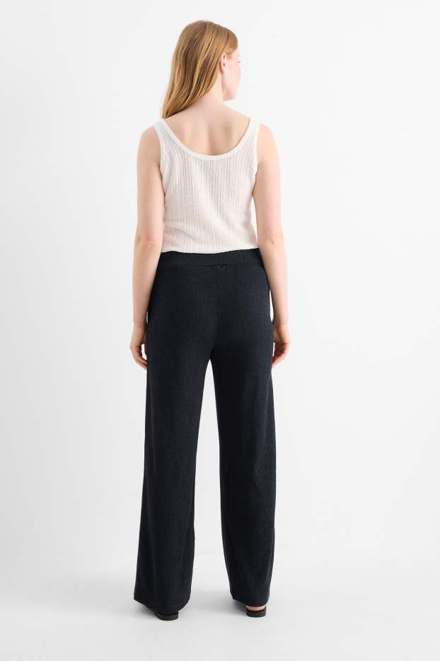 Dona - Pantalons de punt - mid waist - wide leg - texturats - negre
