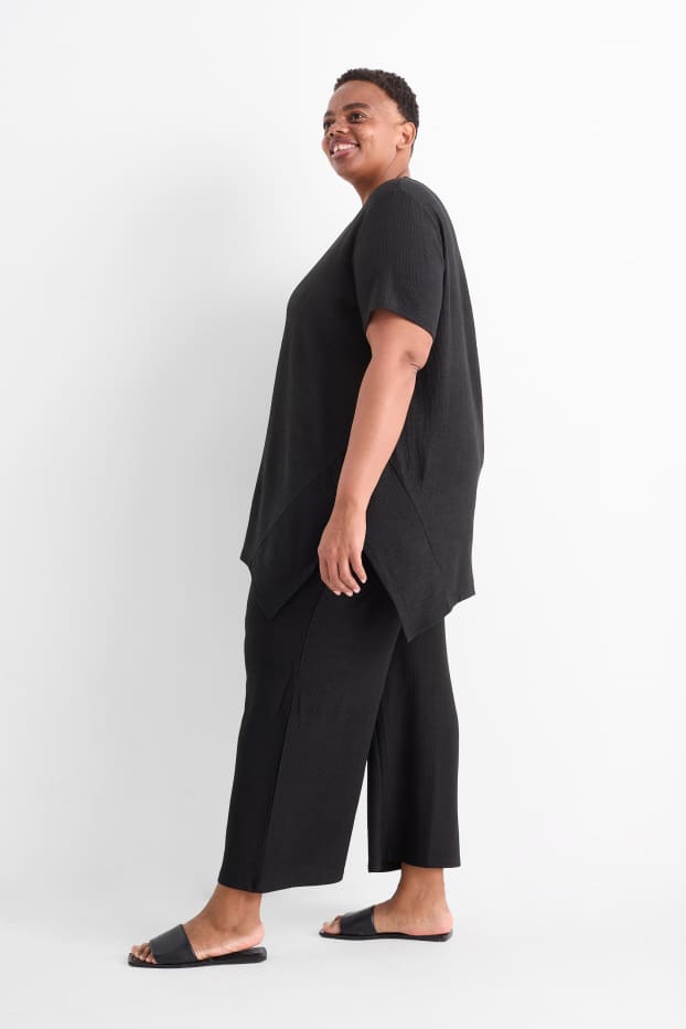 Femmes - Pantalon en jersey - mid waist - wide leg - finition texturée - noir