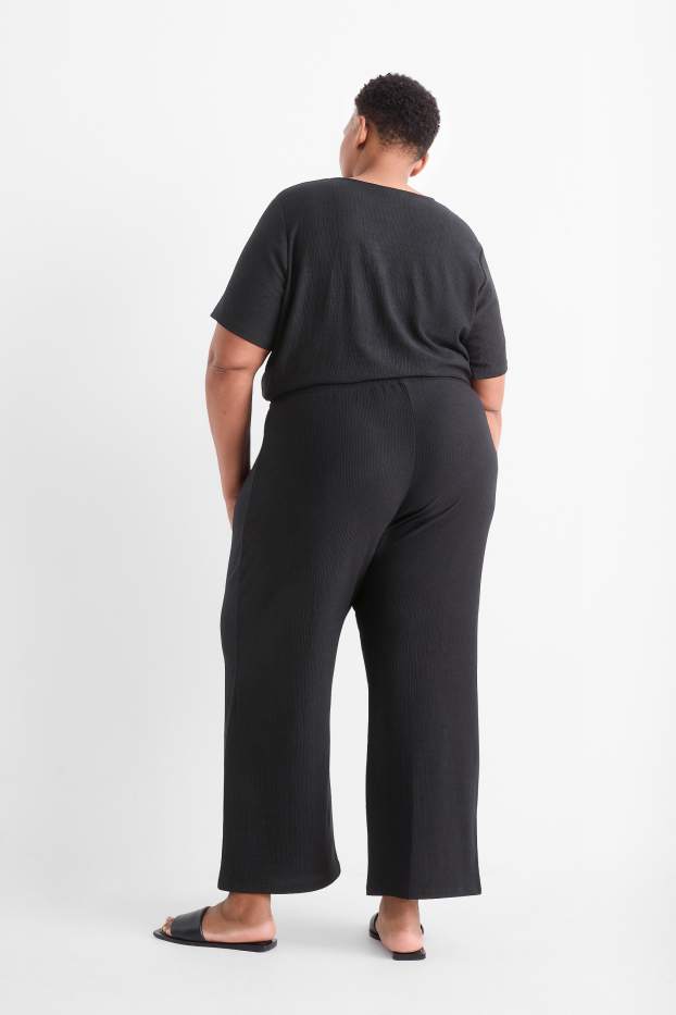 Femmes - Pantalon en jersey - mid waist - wide leg - finition texturée - noir