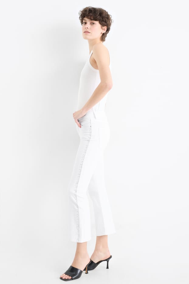 Women - Cropped bootcut jeans with rhinestones - mid-rise waist - white