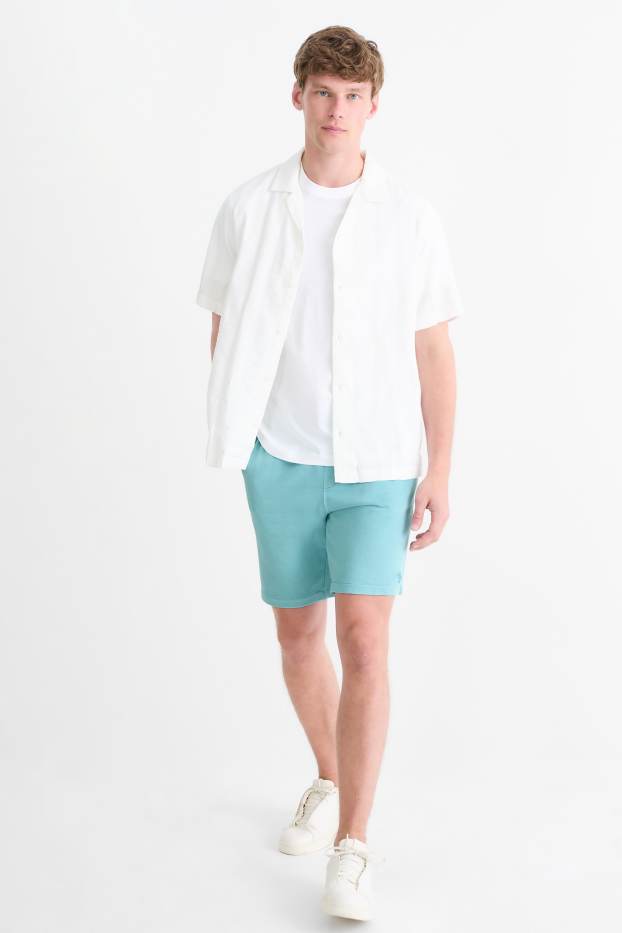 Bărbați - Pantaloni scurți de trening - turcoaz