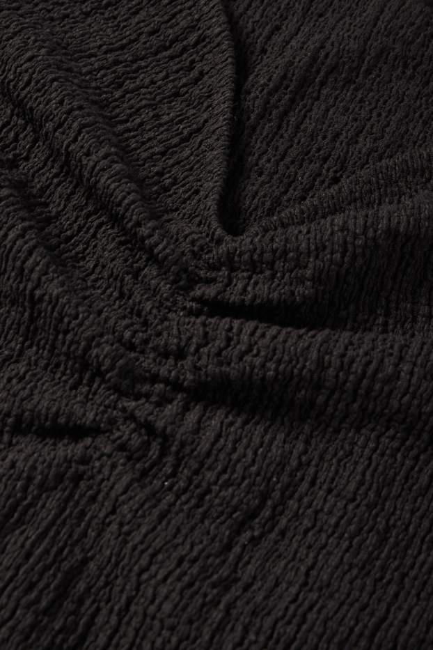 Dona - Samarreta de mànigues curtes - texturada - negre