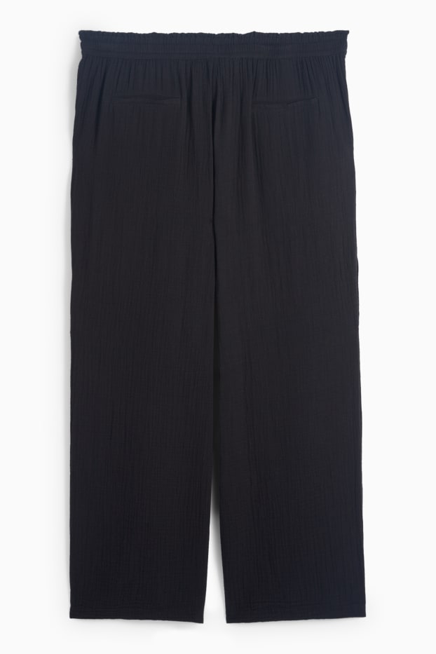 Dona - Pantalons de tela - mid waist - comfort fit - texturats - negre