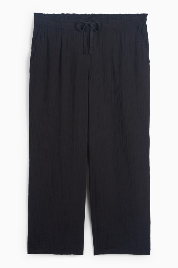 Dona - Pantalons de tela - mid waist - comfort fit - texturats - negre