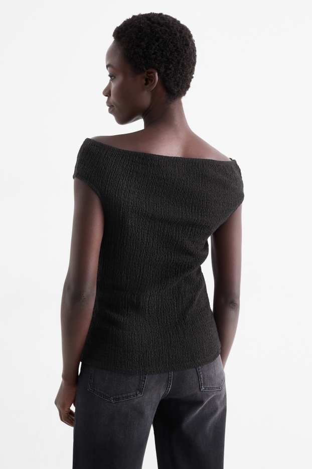 Dona - Samarreta de mànigues curtes - texturada - negre