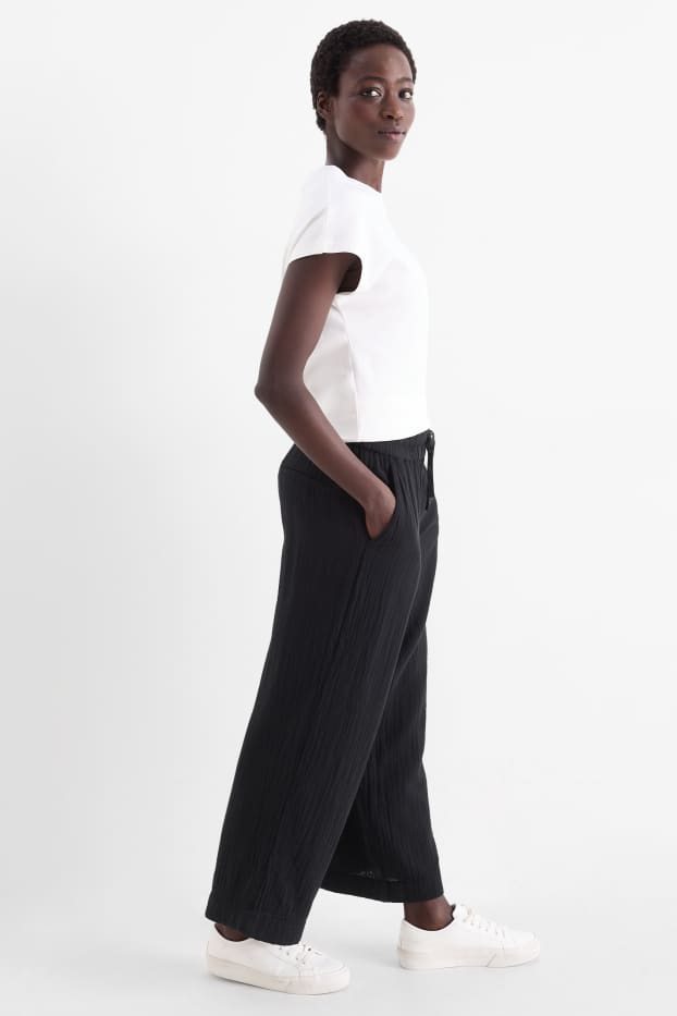 Women - Cloth trousers - high waist - wide leg - black