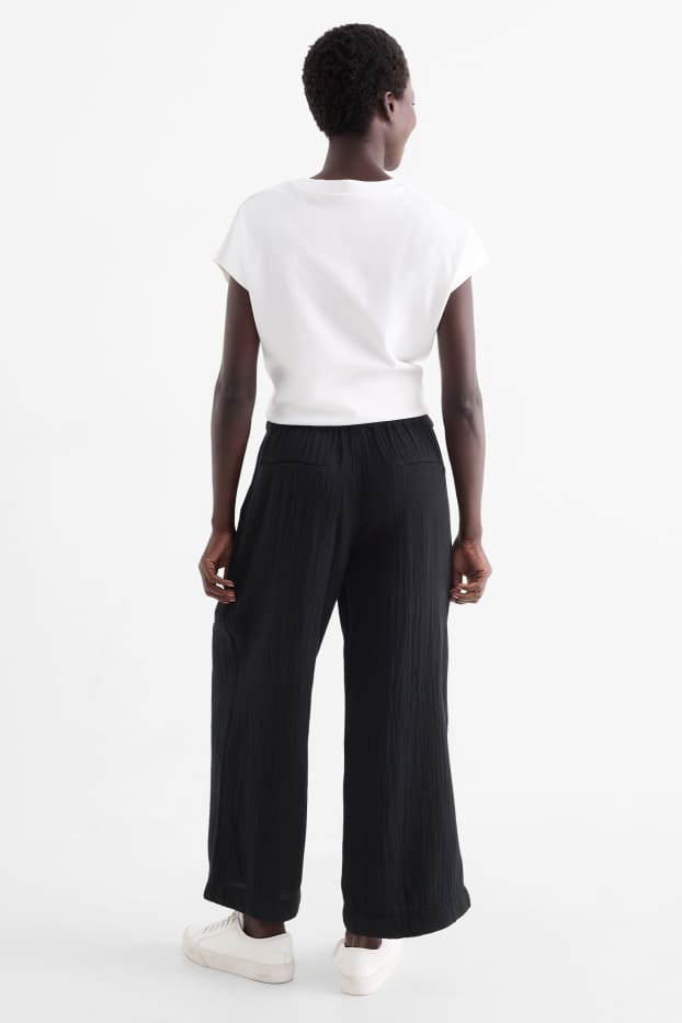 Women - Cloth trousers - high waist - wide leg - black