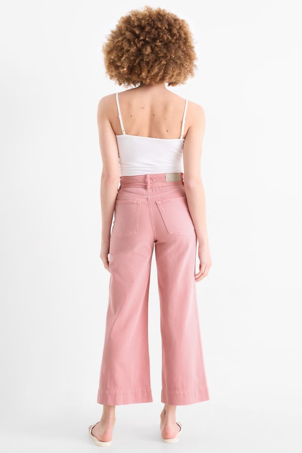 Dámské - Krátké wide leg jeans s páskem - mid waist - růžová